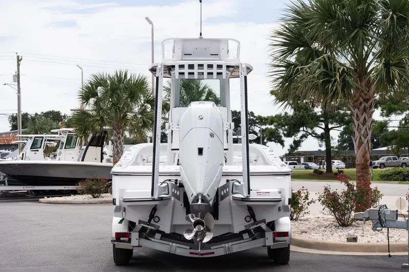 Slide: The Image of 2026 Blackfin 262 HB boat on trailer, surrounded by palm trees in a parking lot. - 8