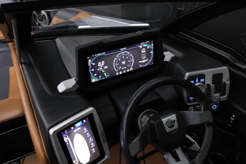 Slide: The Image of 2021 Malibu Wakesetter 20 VTX dashboard with modern digital displays and controls. - 14