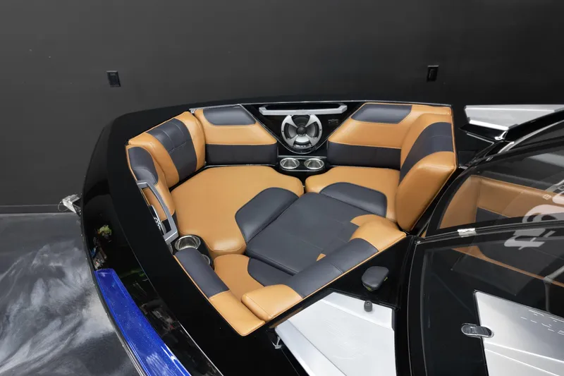 Slide: The Image of 2021 Malibu Wakesetter 20 VTX boat interior with tan and black seating. - 9