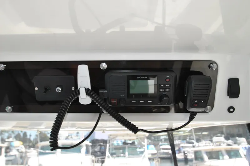 Slide: The Image of Control panel of 2019 Jeanneau NC 795 Sport with Garmin marine radio. - 11