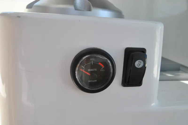 Slide: The Image of Gauge and switch on 2019 Jeanneau NC 795 Sport boat dashboard. - 12