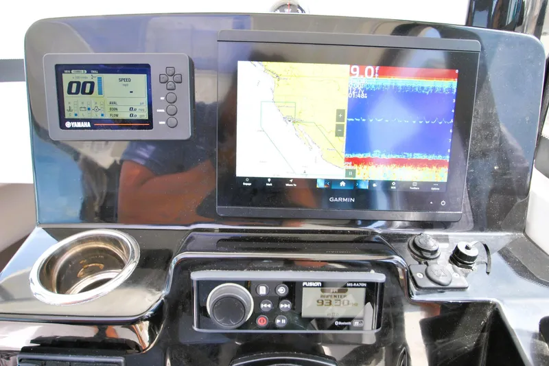Slide: The Image of Dashboard of 2019 Jeanneau NC 795 Sport with Yamaha and Garmin displays. - 18