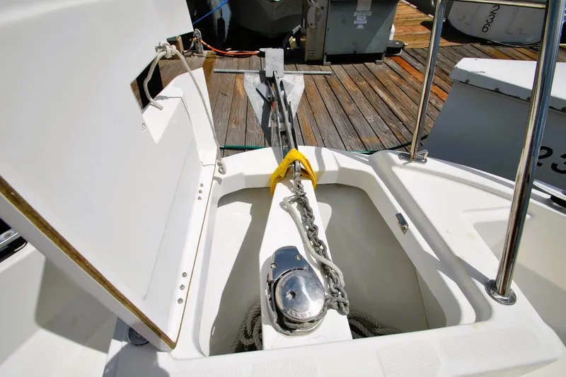 Slide: The Image of 2019 Jeanneau NC 795 Sport anchor locker with chain and winch on deck. - 19