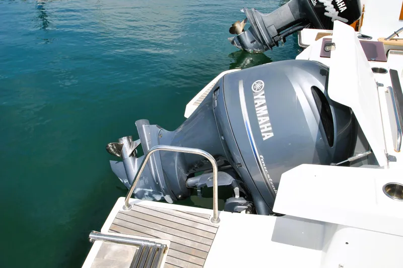 Slide: The Image of 2019 Jeanneau NC 795 Sport with Yamaha outboard motor on calm water. - 20
