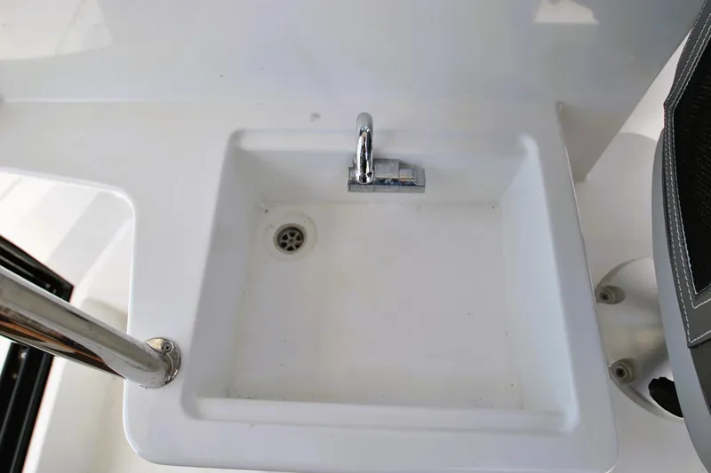 Slide: The Image of Sink area on 2019 Jeanneau NC 795 Sport boat, featuring a chrome faucet. - 24