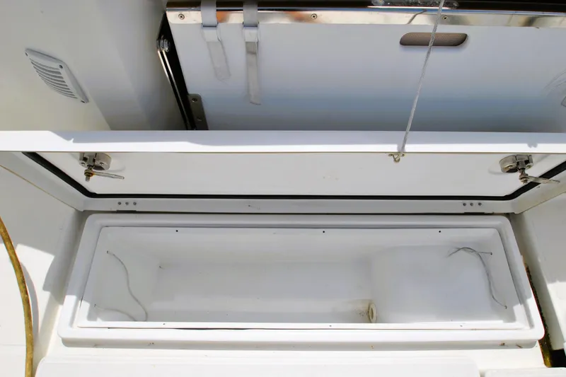 Slide: The Image of Open storage compartment on 2019 Jeanneau NC 795 Sport boat, showcasing interior space. - 25
