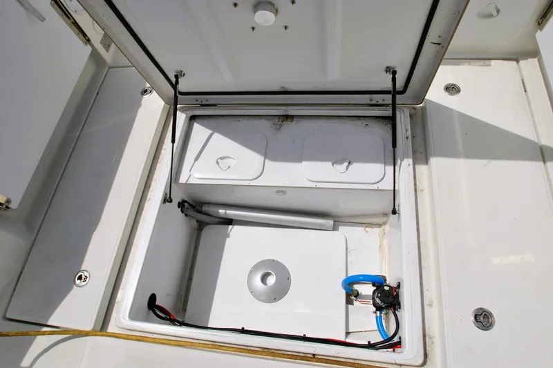 Slide: The Image of Open storage compartment on 2019 Jeanneau NC 795 Sport boat, showcasing interior details. - 27