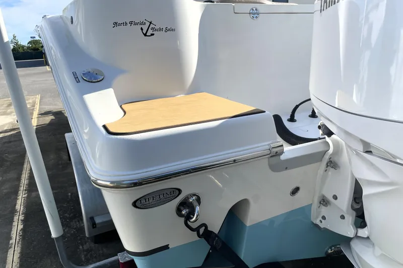 Slide: The Image of 2020 NauticStar 28 XS boat stern with North Florida Yacht Sales branding. - 12