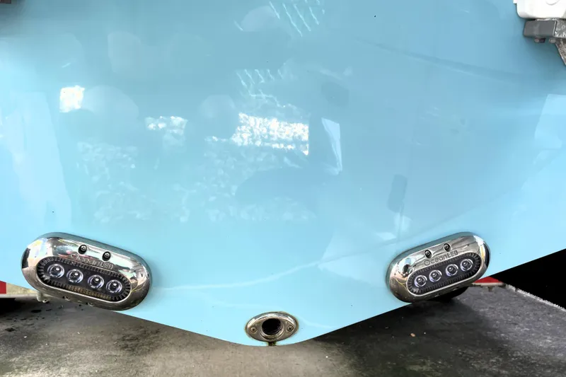 Slide: The Image of 2020 NauticStar 28 XS boat with underwater LED lights on the hull. - 14