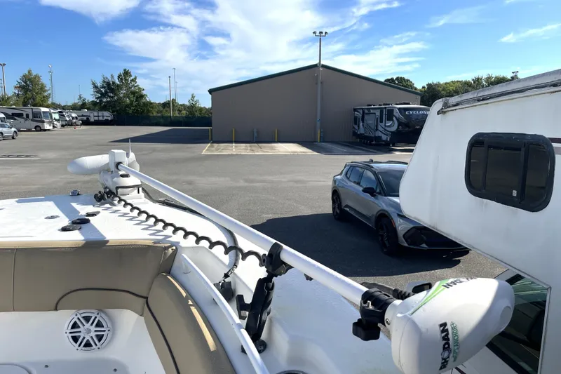 Slide: The Image of 2020 NauticStar 28 XS boat with trolling motor in parking lot. - 17