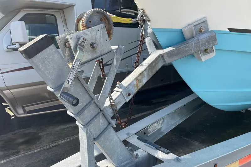 Slide: The Image of Trailer hitch securing a 2020 NauticStar 28 XS boat with blue hull. - 25