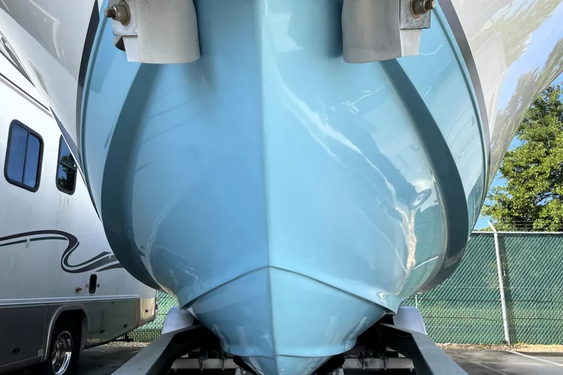 Slide: The Image of 2020 NauticStar 28 XS boat hull in storage, close-up view. - 8