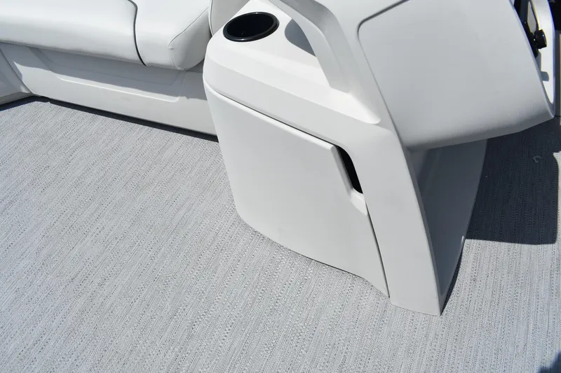 Slide: The Image of 2026 Godfrey SWEETWATER 2086SB boat interior with white seating and textured flooring. - 12