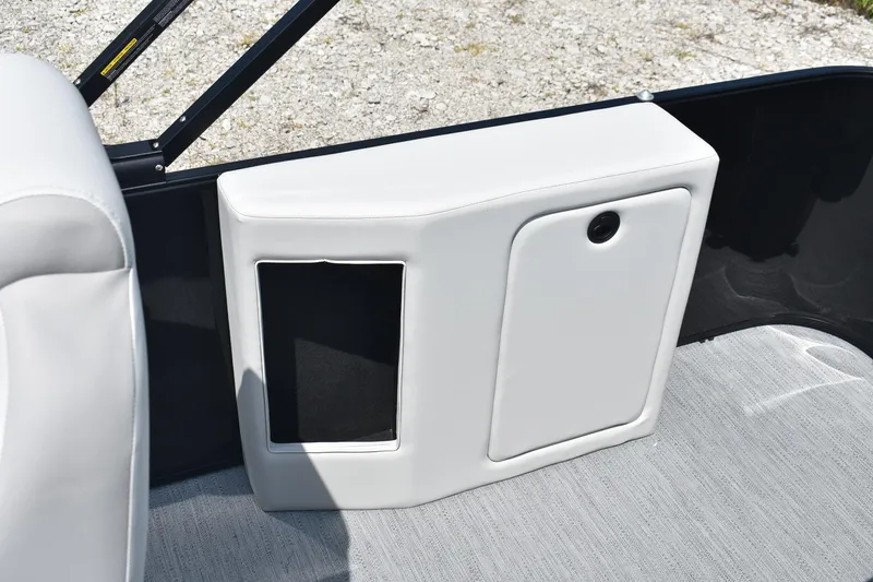 Slide: The Image of 2026 Godfrey Sweetwater 2086 C boat interior storage compartment with white upholstery. - 14