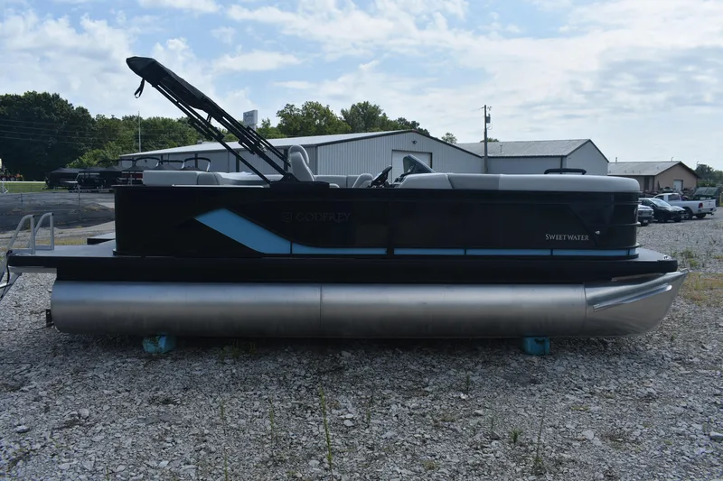 Slide: The Image of 2026 Godfrey SWEETWATER 2086SB pontoon boat on gravel lot, side view. - 6