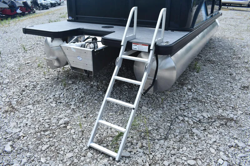 Slide: The Image of 2026 Godfrey SWEETWATER 2086SB pontoon boat with ladder on gravel surface. - 7