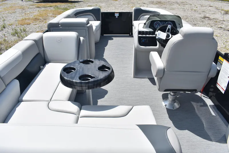 Slide: The Image of Interior of 2026 Godfrey SWEETWATER 2086SB pontoon boat with plush seating and helm. - 8