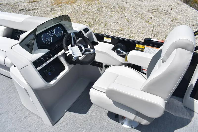 Slide: The Image of 2026 Godfrey SWEETWATER 2086SB boat interior with modern steering console and captain's chair. - 9