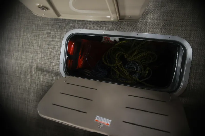 Slide: The Image of Storage compartment on a 2015 Bennington 24 SSLX boat with ropes inside. - 17