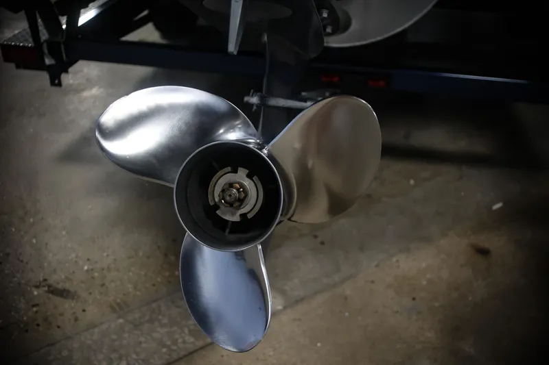Slide: The Image of Close-up of a 2015 Bennington 24 SSLX boat propeller in a garage setting. - 20