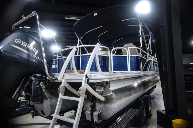 Slide: The Image of 2015 Bennington 24 SSLX pontoon boat with Yamaha engine in indoor showroom. - 6