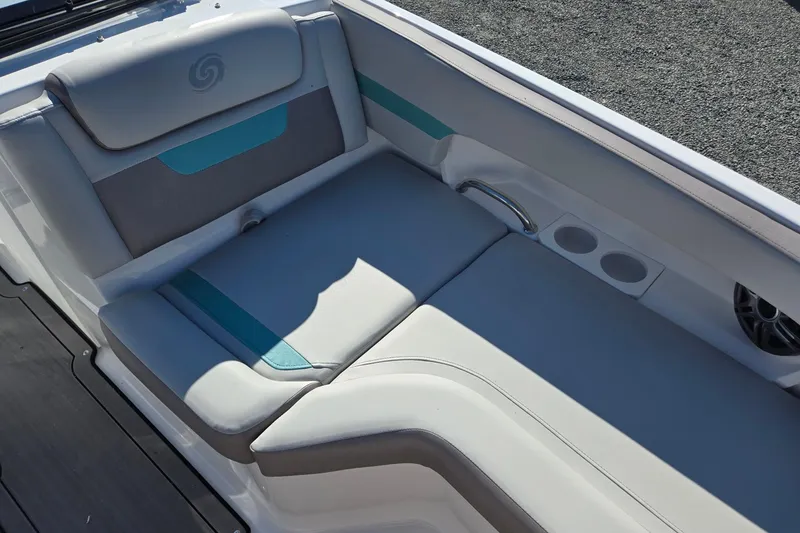 Slide: The Image of 2026 Hurricane SunDeck 235 OB boat interior with cushioned seating and cup holders. - 12