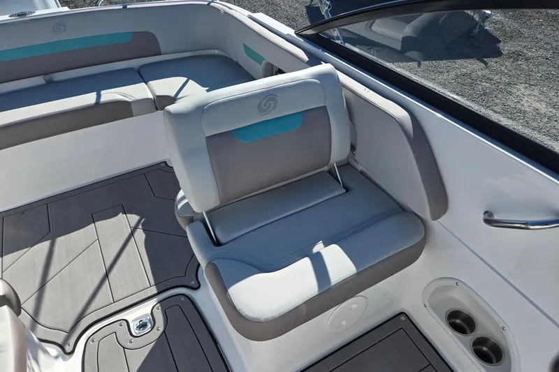 Slide: The Image of 2026 Hurricane SunDeck 235 OB boat interior with cushioned seating and cup holders. - 15