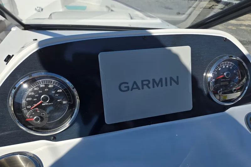 Slide: The Image of Dashboard of 2026 Hurricane SunDeck 235 OB with Garmin display and gauges. - 18