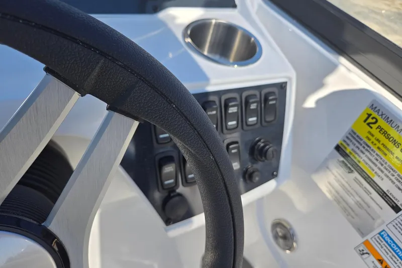 Slide: The Image of Steering wheel and control panel of 2026 Hurricane SunDeck 235 OB boat. - 20