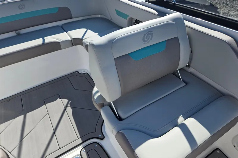 Slide: The Image of 2026 Hurricane SunDeck 235 OB boat interior with gray and teal seating. - 24