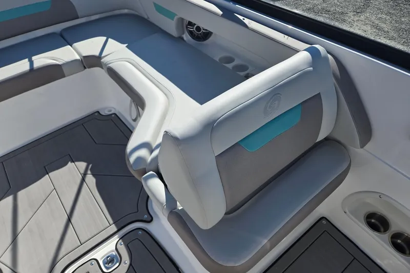 Slide: The Image of 2026 Hurricane SunDeck 235 OB boat interior with cushioned seating and cup holders. - 25