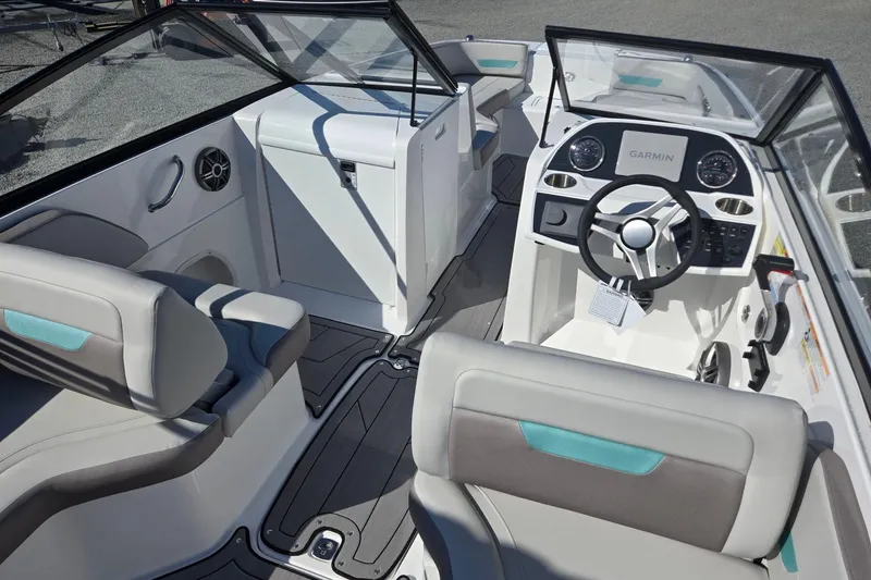 Slide: The Image of 2026 Hurricane SunDeck 235 OB boat interior with modern steering and seating. - 32