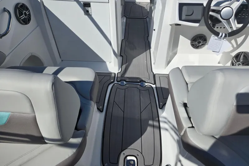 Slide: The Image of 2026 Hurricane SunDeck 235 OB interior with sleek seating and modern dashboard design. - 36