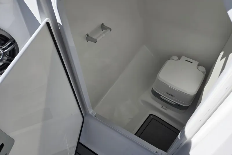 Slide: The Image of Compact marine toilet in 2026 Hurricane SunDeck 235 OB boat cabin. - 38