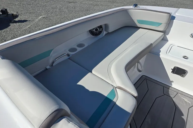 Slide: The Image of 2026 Hurricane SunDeck 235 OB boat interior with cushioned seating and cup holders. - 42