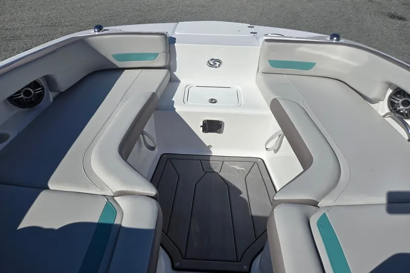 Slide: The Image of 2026 Hurricane SunDeck 235 OB boat interior with cushioned seating and storage compartments. - 43