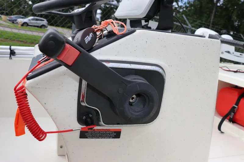 Slide: The Image of Close-up of 2023 Mako Pro Skiff 13 CC boat control panel with safety features. - 21