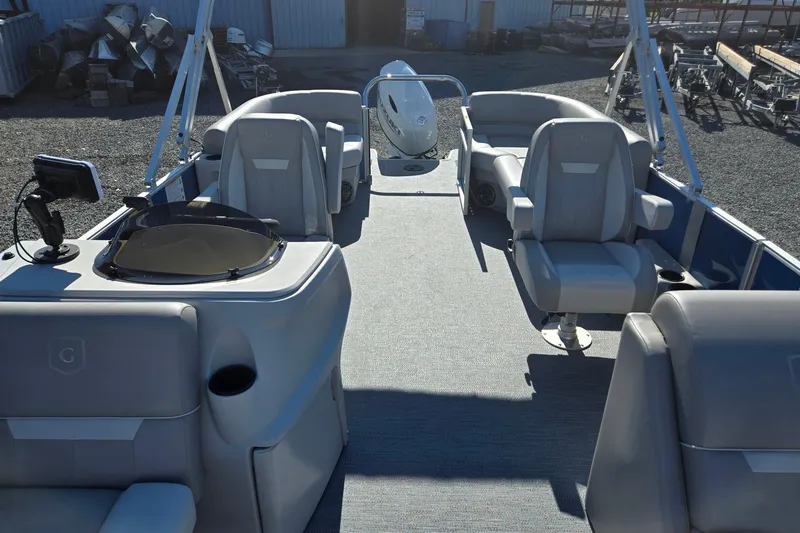 Slide: The Image of 2026 Godfrey Xperience 2286 SBX pontoon boat interior with seating and helm. - 10