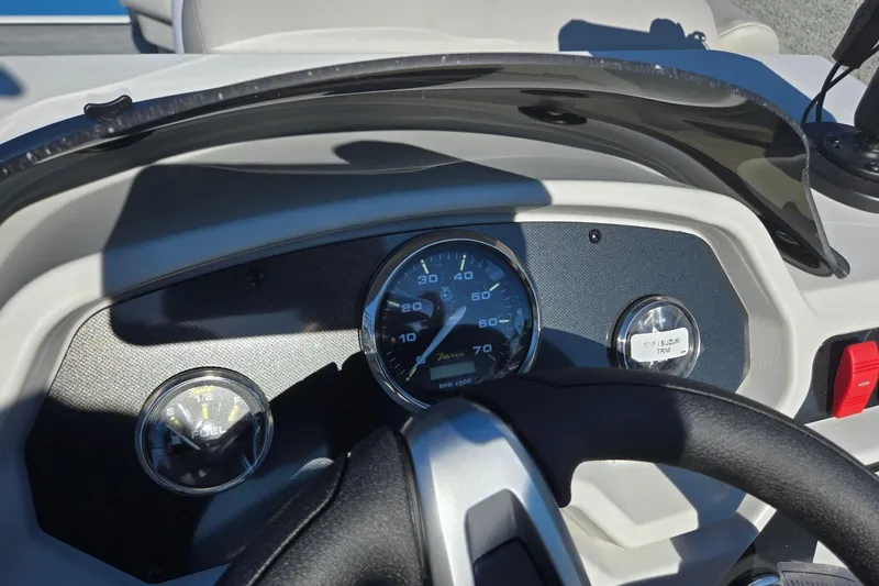 Slide: The Image of Dashboard of 2026 Godfrey Xperience 2286 SBX boat with gauges and steering wheel. - 17