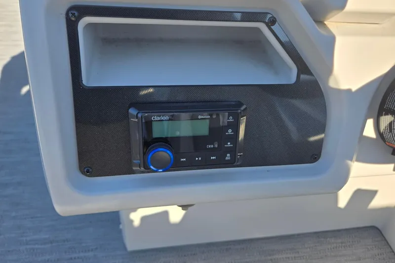 Slide: The Image of Clarion audio system on 2026 Godfrey Xperience 2286 SBX boat dashboard. - 18