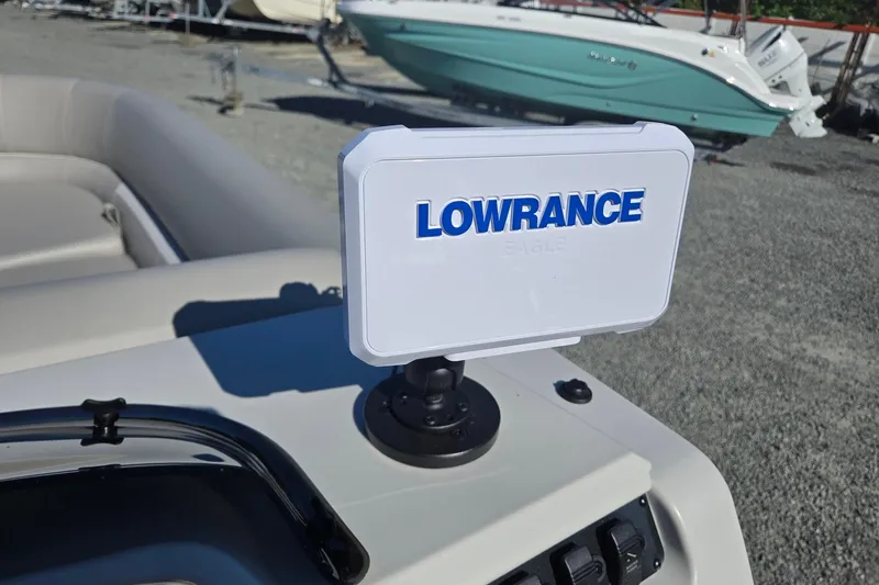 Slide: The Image of Lowrance device on 2026 Godfrey Xperience 2286 SBX boat dashboard, outdoor setting. - 19