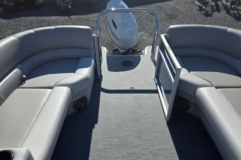 Slide: The Image of 2026 Godfrey Xperience 2286 SBX pontoon boat interior with gray seating and outboard motor. - 22