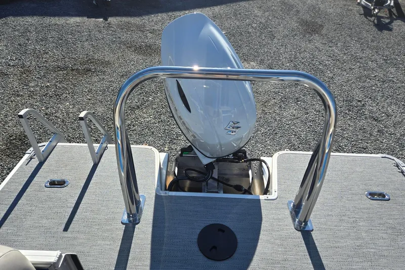 Slide: The Image of 2026 Godfrey Xperience 2286 SBX boat with outboard motor and stainless steel railings. - 25