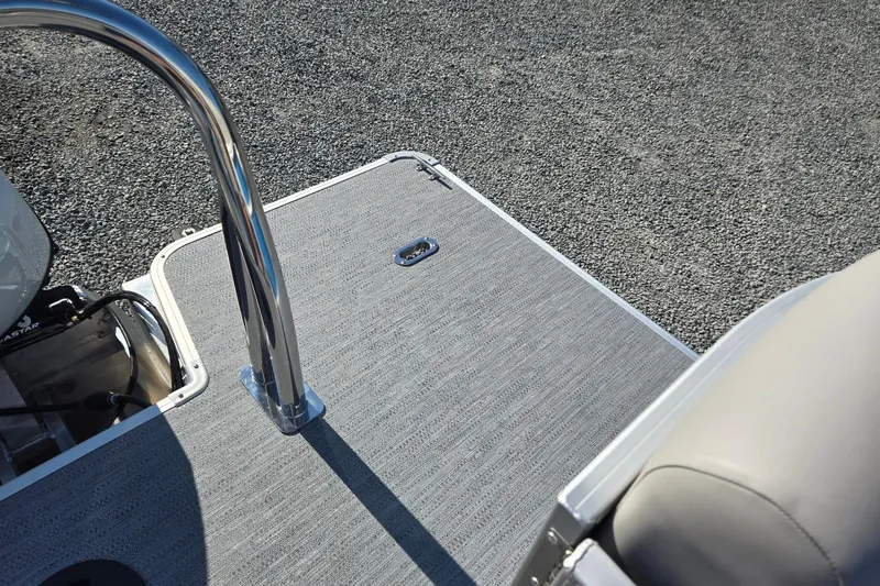 Slide: The Image of 2026 Godfrey Xperience 2286 SBX boat deck with chrome railing and textured flooring. - 27
