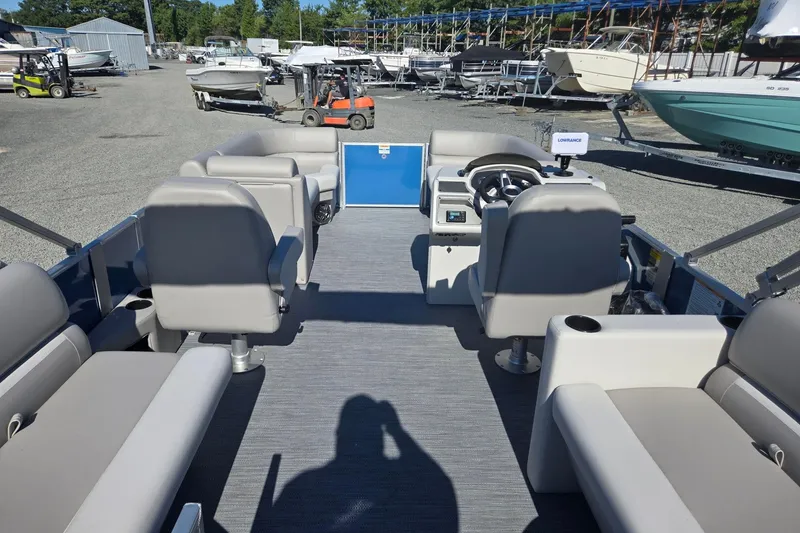 Slide: The Image of 2026 Godfrey Xperience 2286 SBX pontoon boat interior with seating and steering console. - 29