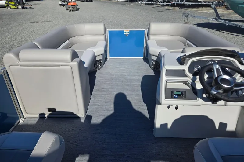 Slide: The Image of 2026 Godfrey Xperience 2286 SBX pontoon boat interior with plush seating and modern helm. - 32