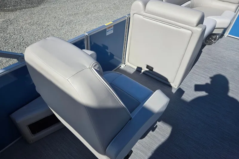 Slide: The Image of 2026 Godfrey Xperience 2286 SBX boat interior with gray seating and shadow on deck. - 33