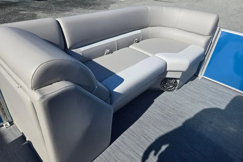 Slide: The Image of 2026 Godfrey Xperience 2286 SBX boat interior with gray seating and blue panel. - 36