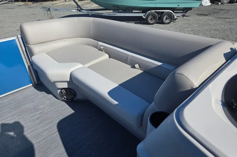 Slide: The Image of 2026 Godfrey Xperience 2286 SBX boat interior with comfortable seating and cup holder. - 37