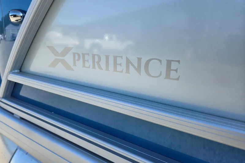Slide: The Image of Close-up of 2026 Godfrey Xperience 2286 SBX logo on boat exterior. - 38